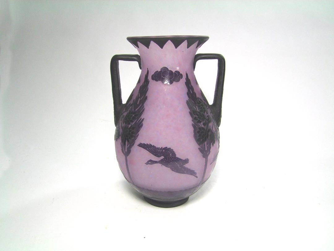 Art Deco Cameo Glass Vase: Double handle vase with trees up from the bottom going towards the top and carved into the handles. Four carved ducks fly around the body. This vase has been drilled for a lamp. 8 3/4" wide at the han