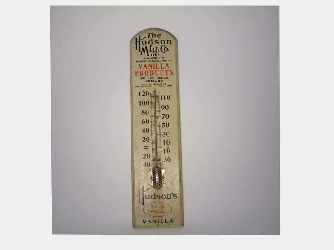 Hudson Mfg. Co. Inc. Advertising Thermometer: 6" x 24" high advertising The Hudson Mfg. Co., Importers and Manufacturers of Vanilla Products. Lightly weathered but still in very good condition.
