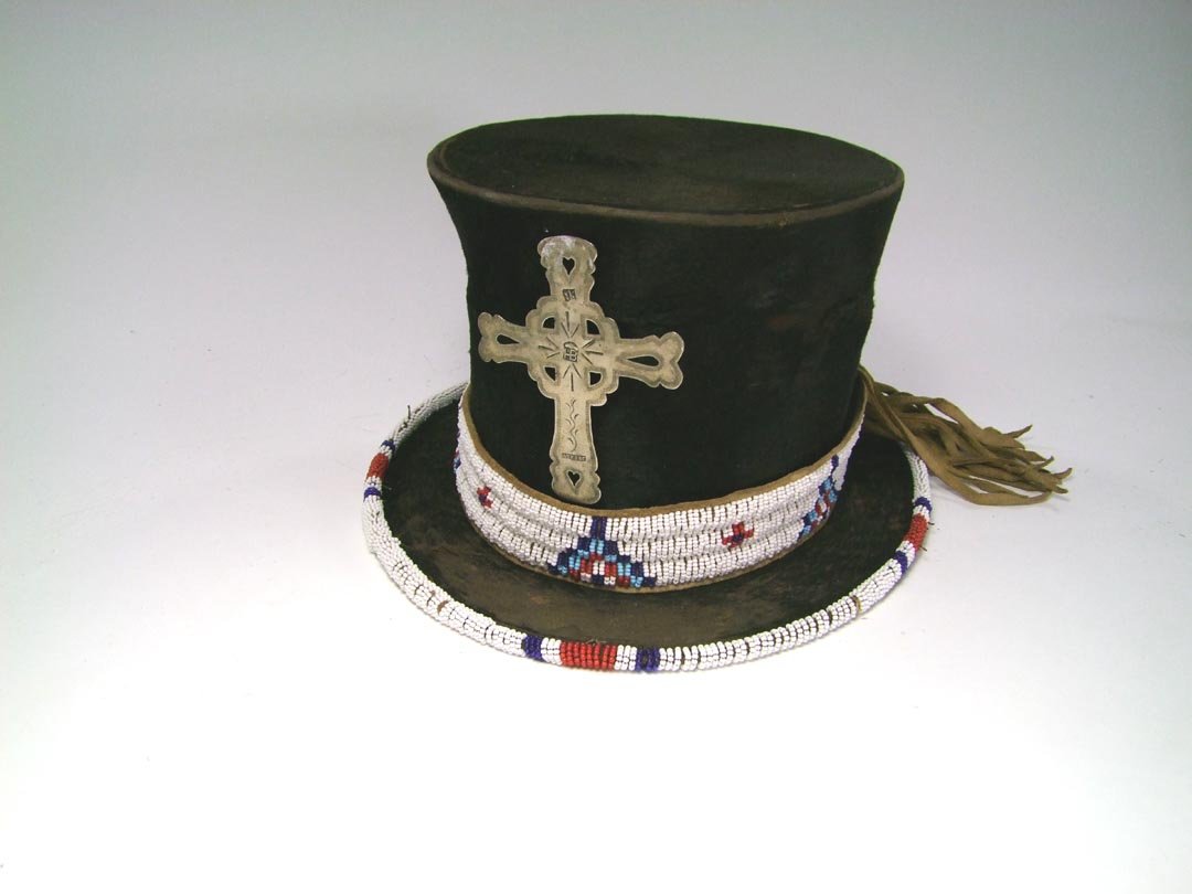 Sioux Beaded Top Hat: 1890s - 1900s sheared beaver top hat made in Paris and hats like this were worn by Native Americans at special events and occasions. Beaded hatband and rim using colors of red, white and blue. Center 