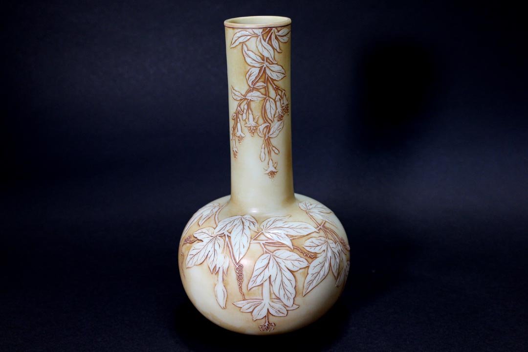 Webb Cameo Vase: Bleeding hearts trailing down the elongated neck and on the bulbous body with a cameo cut butterfly on the back. Signed Thomas Webb & Sons on the base. 5" diameter x 8 3/4" high. Very good condition.