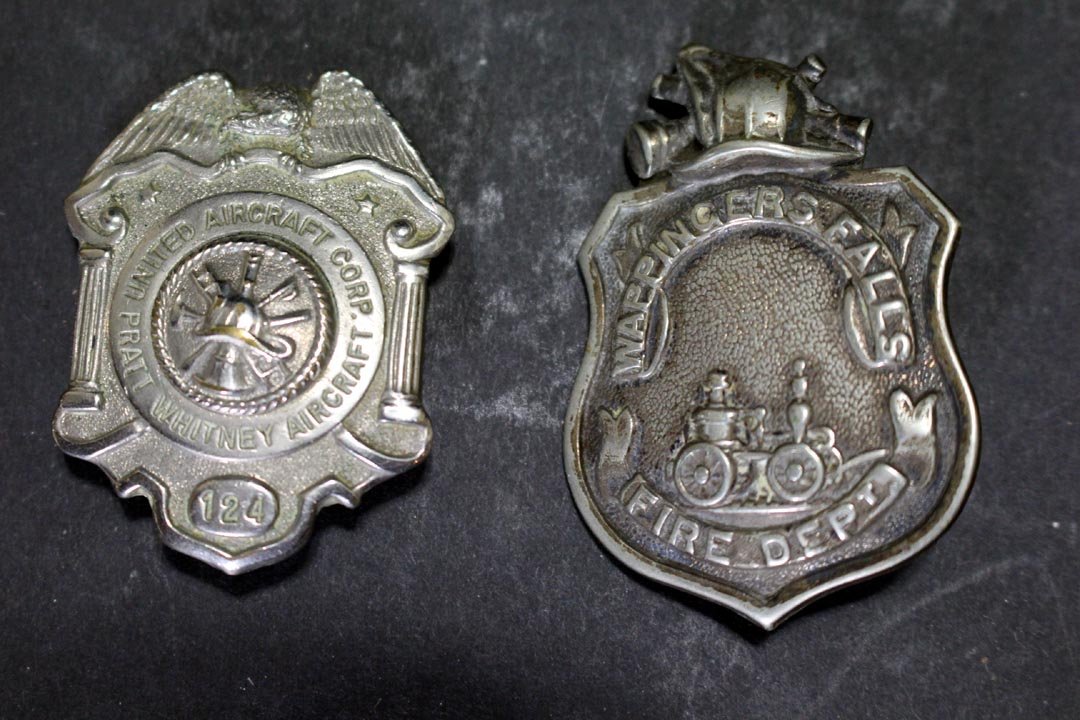 Two Fireman Badges: One United Aircraft Corp. Pratt Whitney Aircraft and Wappingers Falls Fire Dept. 1 3/4" and 2" high.