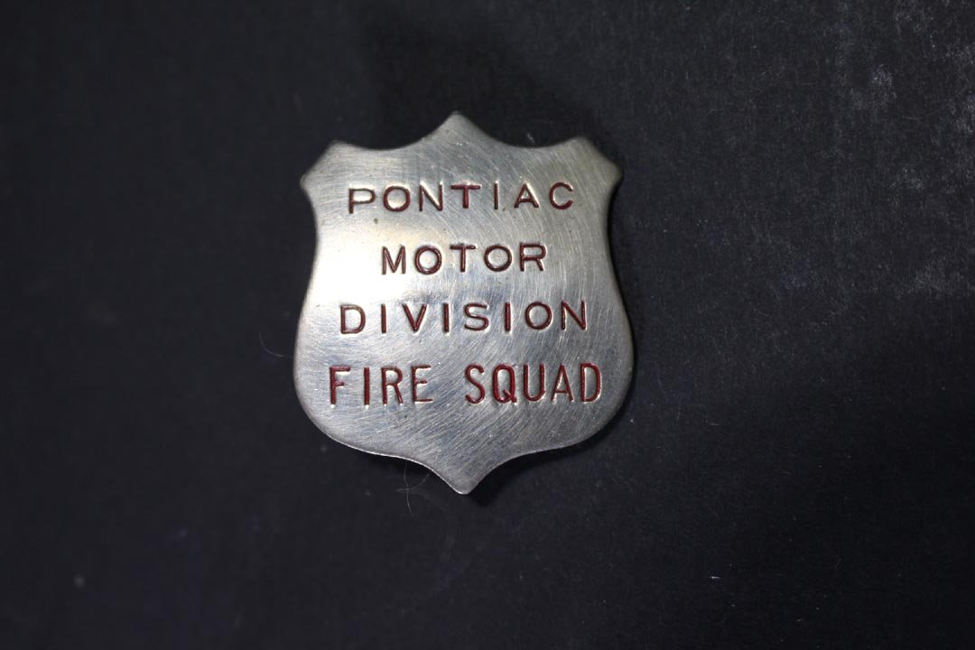 Pontiac Motor Division Fire Squad Badge: Badge in the shape of a shield. 1 1/2" high.