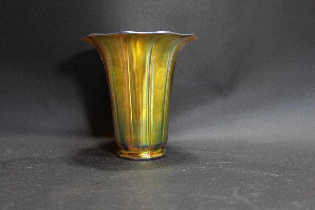 Steuben Lamp Shade Vase: Bright gold ribbed vase with flared top 5 1/4" diameter x 5 1/2" high signed Steuben on the base. Good even iridescence in very good condition.