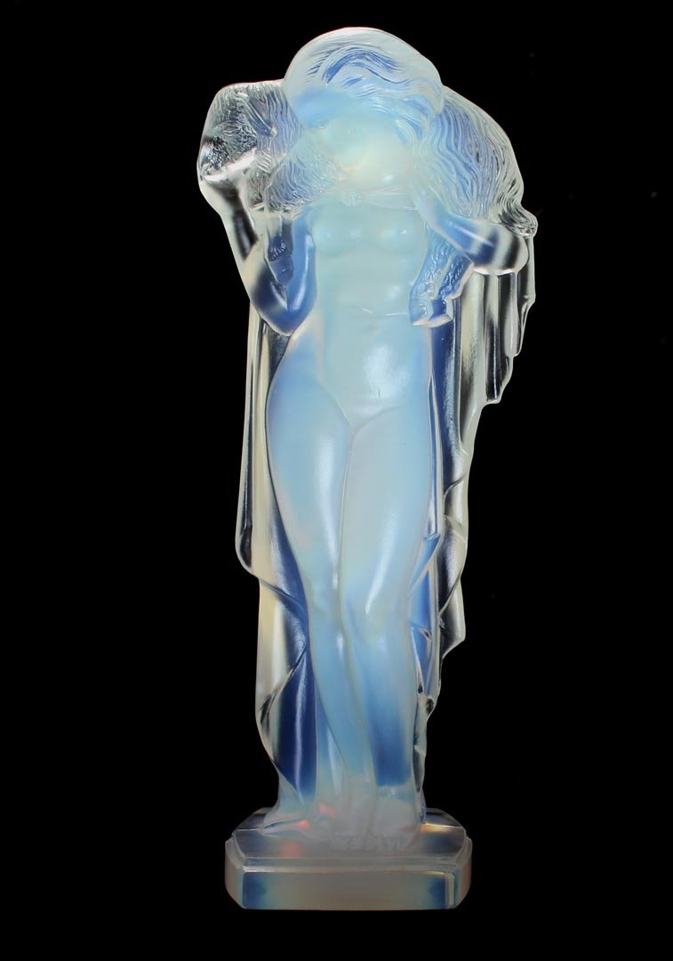 Sabino Woman And Lamb: 10 1/2" opalescent statue of a nude woman carrying a lamb on her shoulders. Signed in script on the bottom. Very good condition.