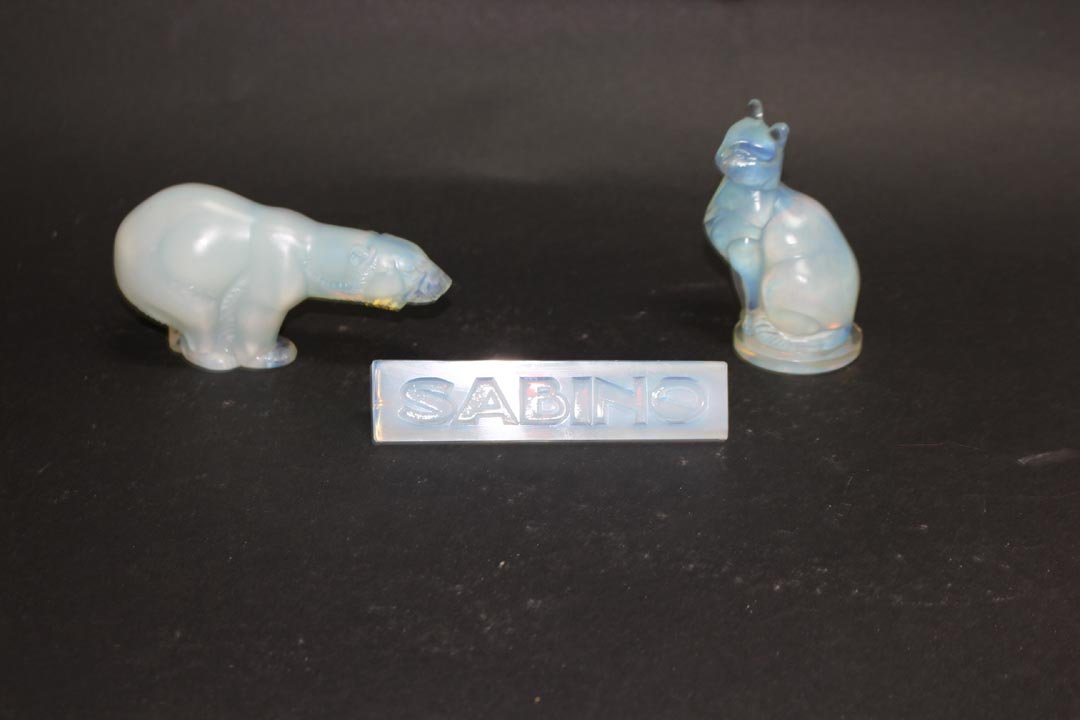 Sabino Bear, Cat and Plaque: 5" x 2 1/2" polar bear signed in script and block letters, 3 3/4" high cat signed in script and 4 3/4" dealers plaque signed in script. All in very good condition.