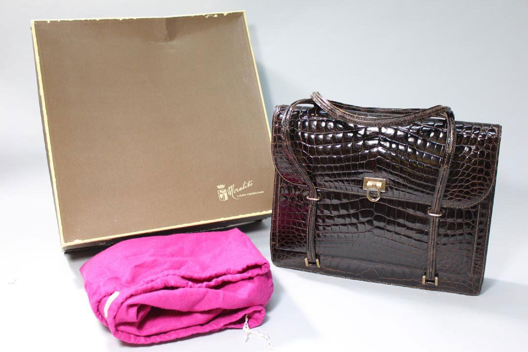 Vintage Morabito Handbag: Complete with the original box and protective felt bag with the Morabito label. Bag measures approximately 13" x 10" high not including the straps. The brass plate on the closure shows slight wear as