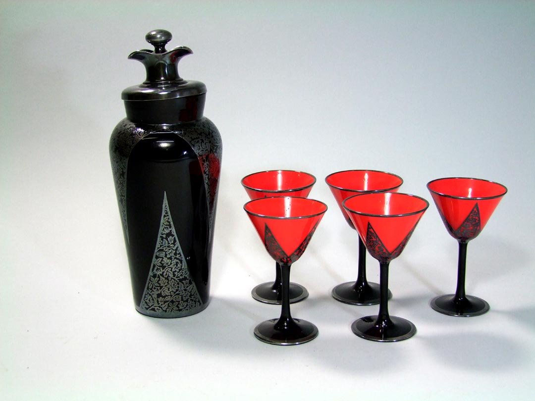 Rockwell Silver Overlay Glass Cocktail Shaker: 11 1/2" Art Deco black amethyst cocktail shaker with sterling silver overlay. There are five 5" martini glasses with red bowls and matching silver overlay. All marked Rockwell and in very good conditi