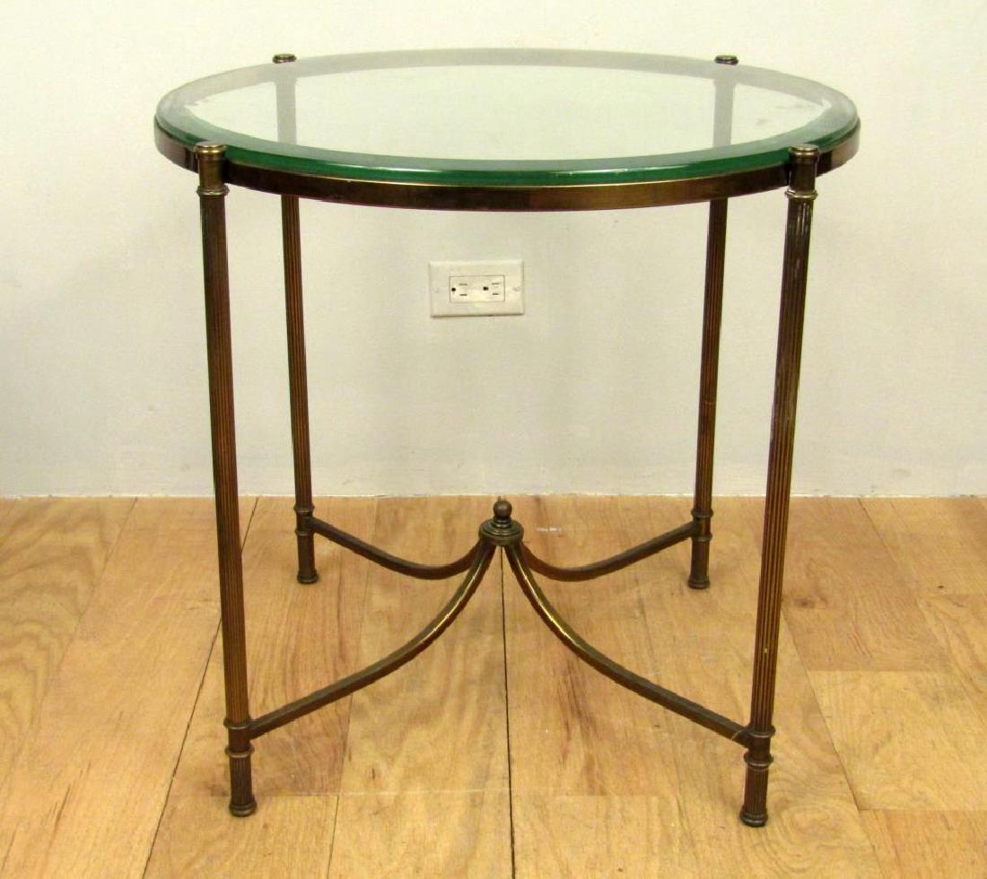 Empire Style Bouillotte/Gueridon Table: Glass top on brass frame. cross stretcher with finial. 26"Dia. X 23.5"H