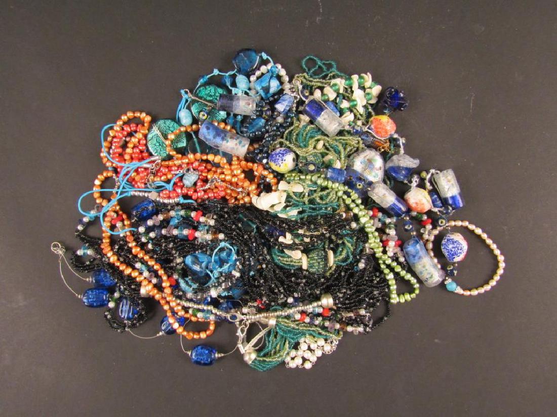 Large Assortment of Costume Jewelry: Necklaces with large colored beads, bracelets, etc.