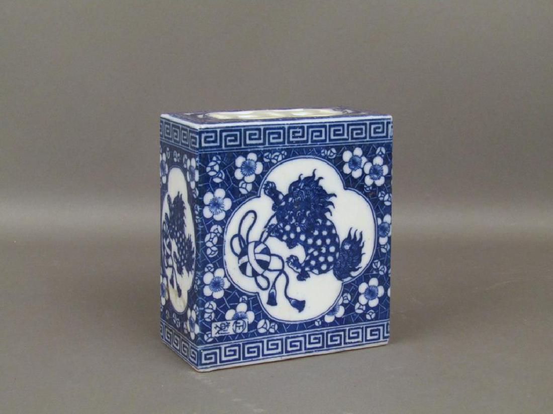 Chinese Blue and White Porcelain Box Vase: Blue ground with white medallions, foo dogs within medallions. 5W X 2.5"D X 6"H"