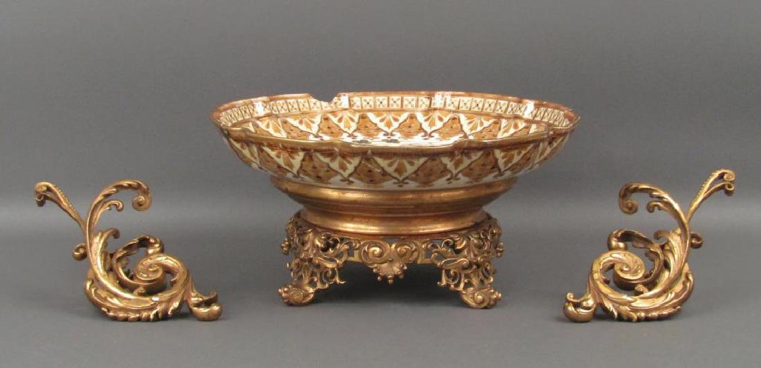 Zsolnay Porcelain Bowl on Stand (As is): Enameled porcelain bowl on gilt bronze base. Bowl with cracks repairs and losses, bowl arms need repair. 13Dia. X 6"H"