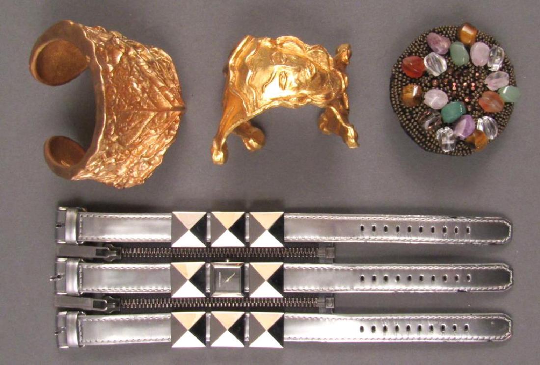 Assorted Designer Jewelry: Karl Lagerfeld wide cuff watch, Kenneth Lane cuff, Carole Saint Germes Paris, and Etro beaded brooch. 9.5"""""200.00300.000.00