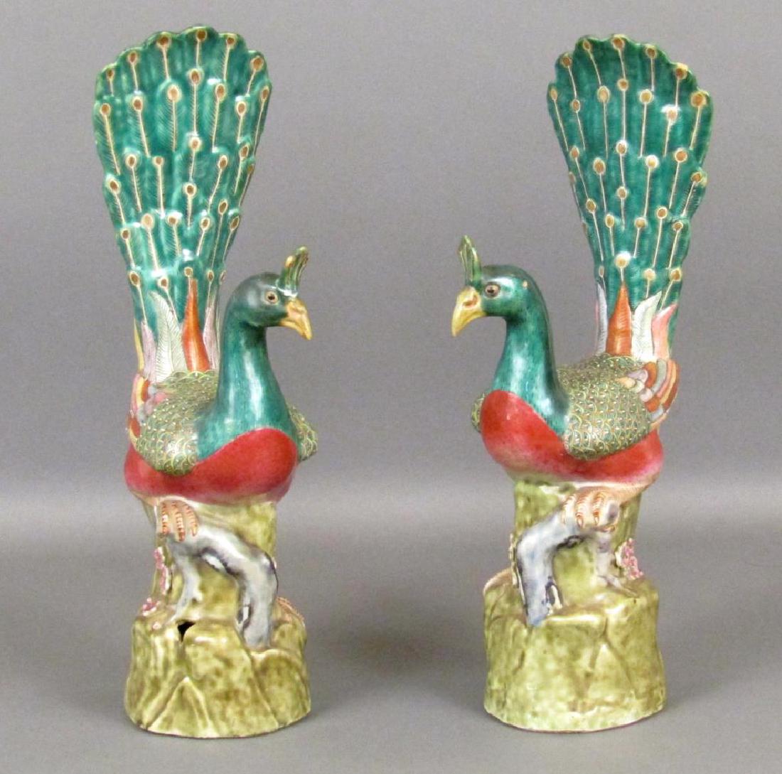 Pair Chinese Porcelain Peacock Figures: On branches. Painted with great colors. As is. Taller 14.5"""""200.00300.000.00