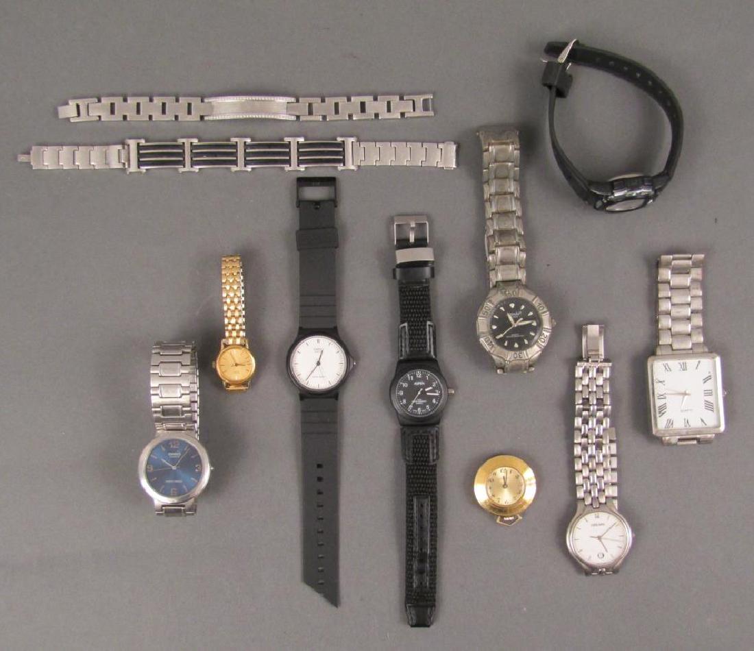 Assorted Man's Watches and 2 Bracelets: Chain link bracelets with inset stones and rubber ridges. Watches: Casio, Seiko, Mondu, etc.