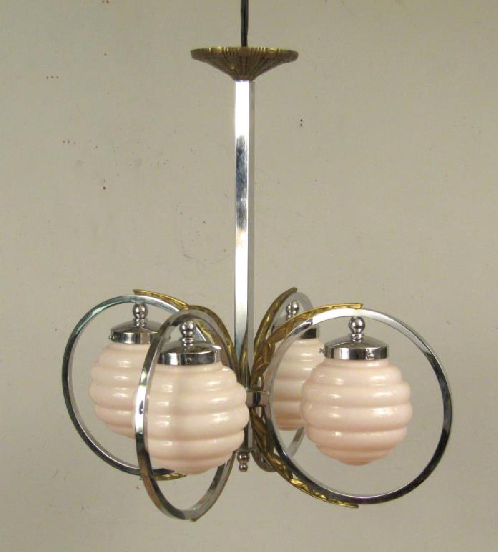 Mid Century 4 Light Fixture: Chrome frame with bronze mounts supporting four pink tinted "bee hive" shape glass shades. 23"Dia. X 23.5"H. 1 metal screw missing from bronze mount.