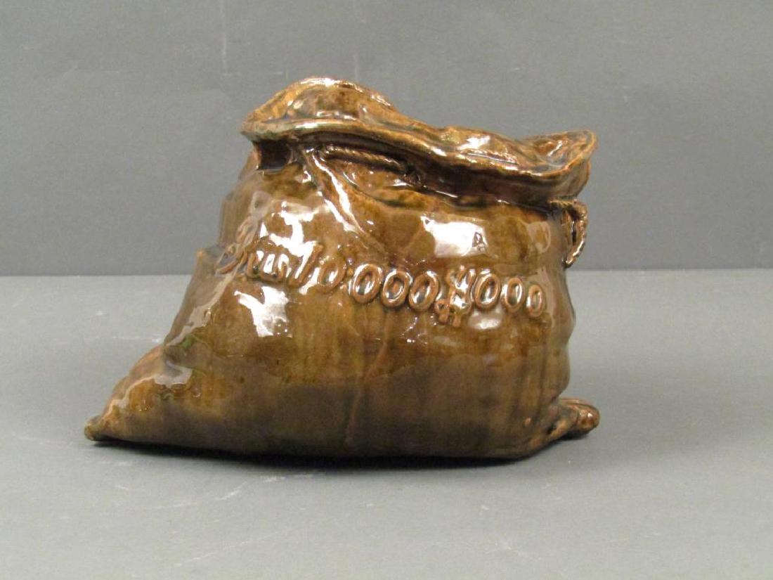 English Glazed Ceramic Money Sack: Very detailed sack with Reu 10:00 $000 designed on front. Stamp on base. 8.5"W X 7"D X 6.5"H