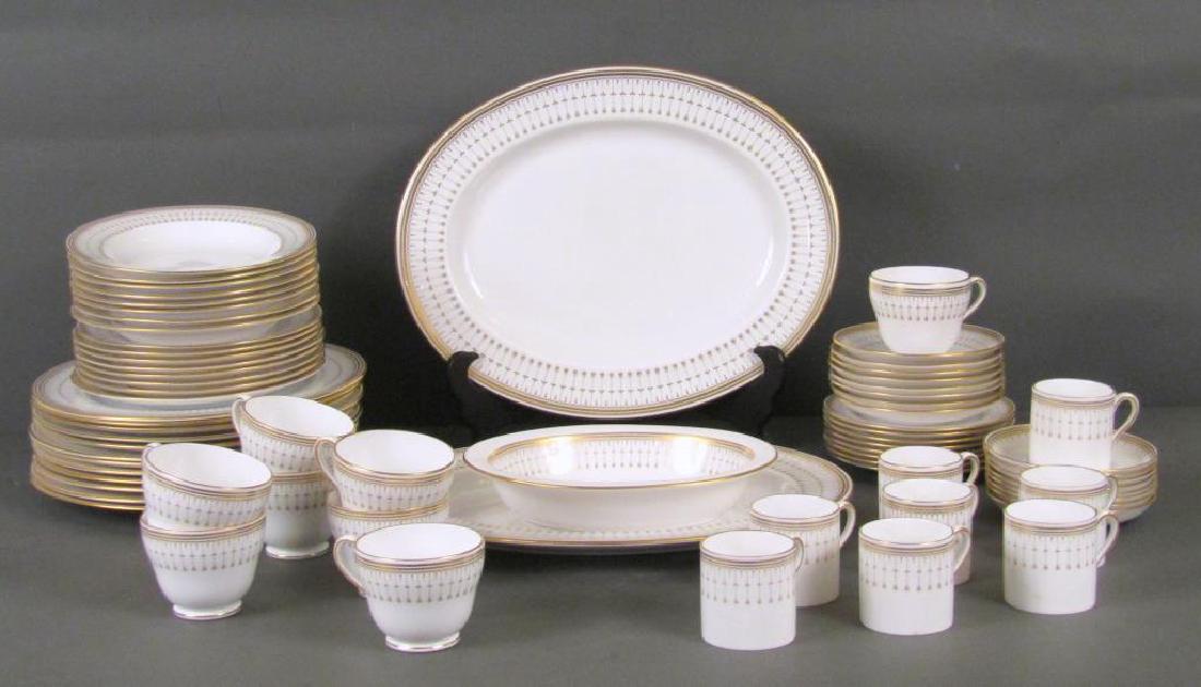 71 Piece Spode Bone China Dinner Set: "Queen's Gate," pattern. Gilt rims with floral pattern. 8 soup bowls, 8 bread plates, 12 dinner plates, 8 teacups and saucers, 2 large serving plates (15"), 1 serving bowl, 8 demitasse cups and saucer