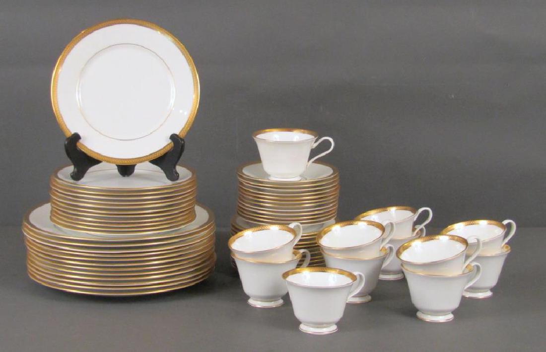 60 Piece Oxford Bone China Dinner Set: "Bennington," pattern. Gilt rims and handles. Service for 12, salad plates, dinner plates, teacups and saucers, and dessert plates. 11"Dia