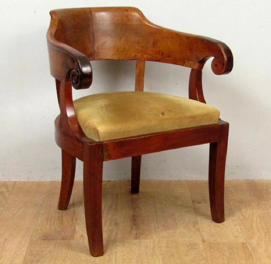 Antique Empire Armchair: Heavy wood frame with scroll arms and roundabout back. Repairs. As is. 25"W X 22"D X 31"H