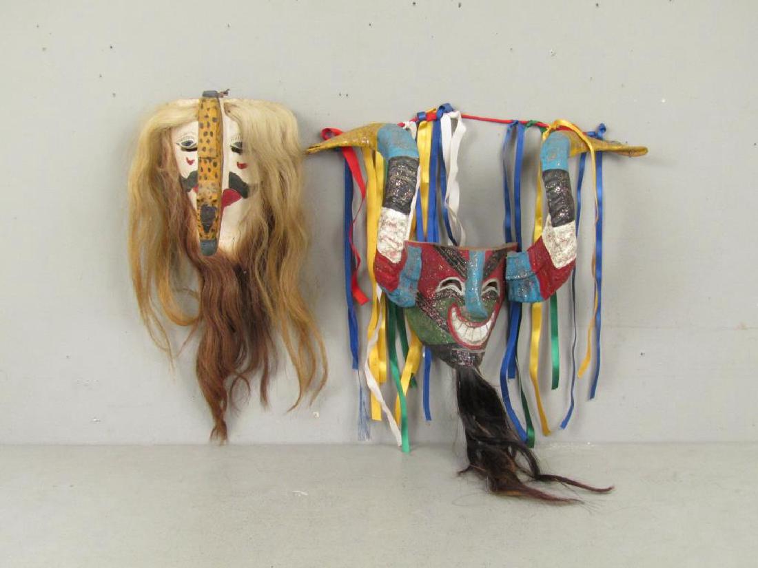 2 Carved and Painted Masks: One with protruding squirrel form nose, other carnival. Larger: 19"W X 26"H