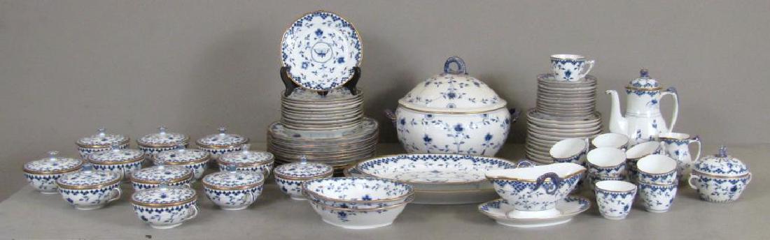52 Piece Kjobenhavn Dinner set.: Bing and Grundahl. Cobalt and white "Onion" pattern with gilt rims. Butterfly designs with seahorse form handles. 12 soup bowls and lids,12 salad plates, 12 dinner plates, one gravy boat, 2 oval servi