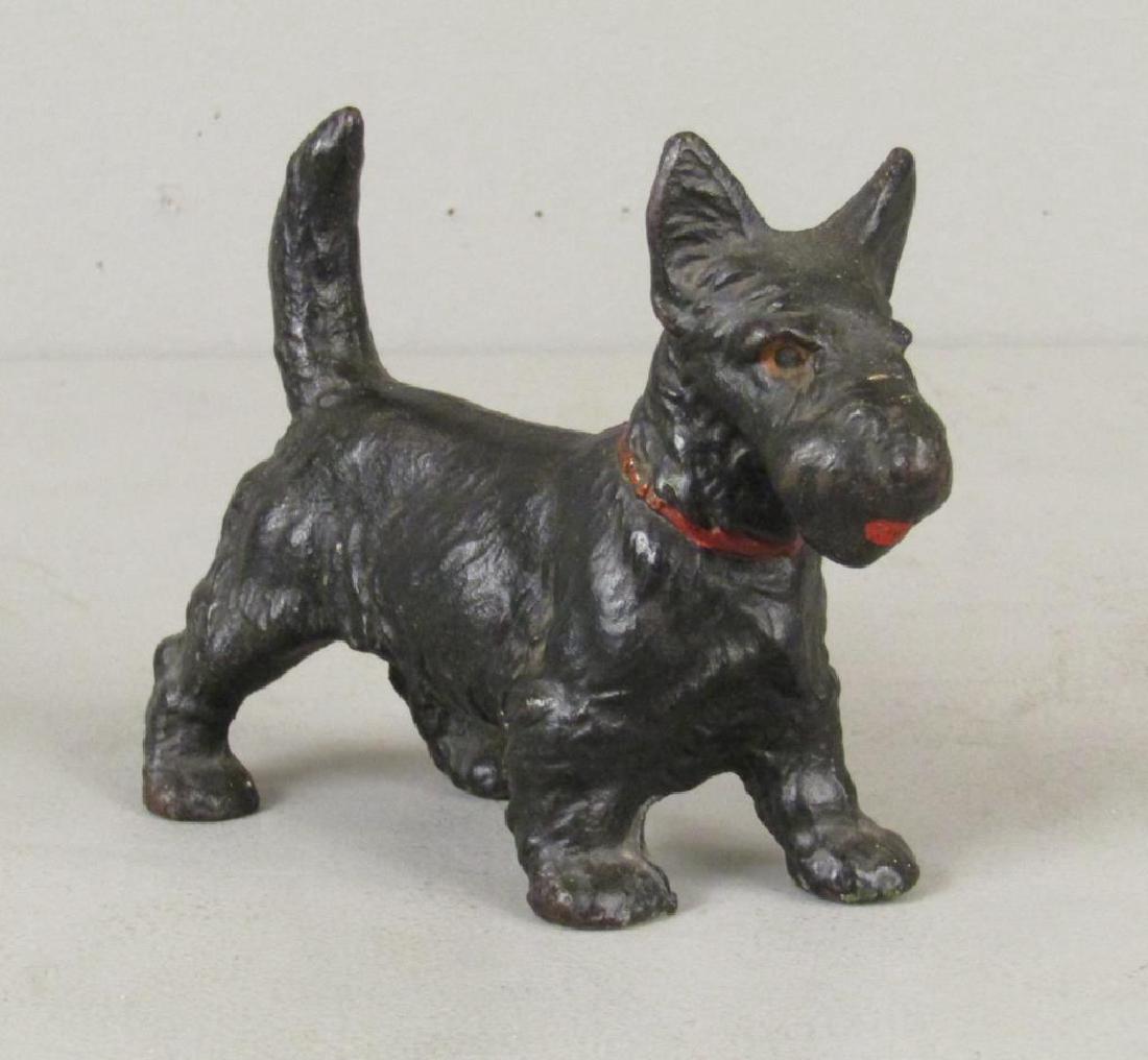 Cast Iron Yorkie / Terrier Doorstop: With painted eyes, mouth, and collar. 6.5"long X 5"H