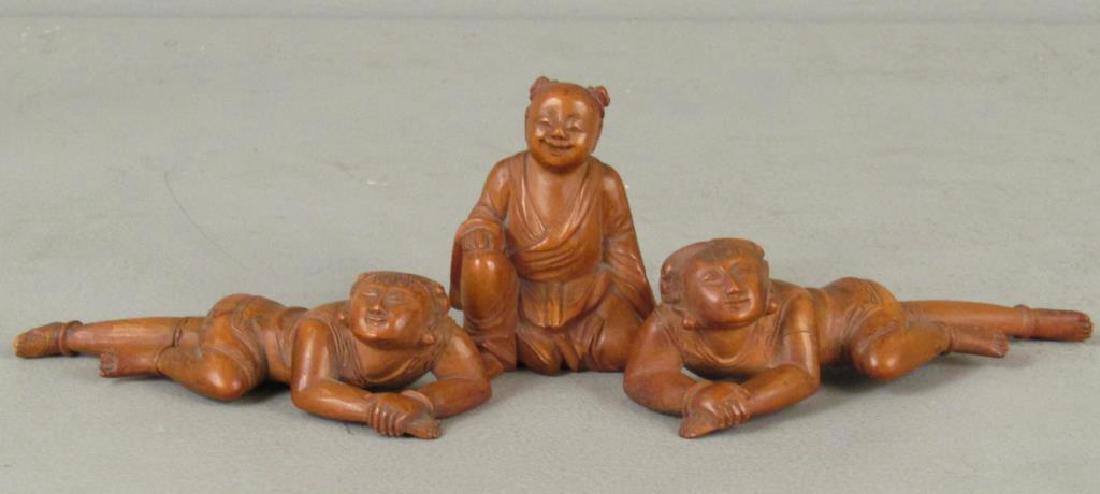 3 Chinese Carved Wood Figures: Two reclining figures and seated Buddha. (3"H)