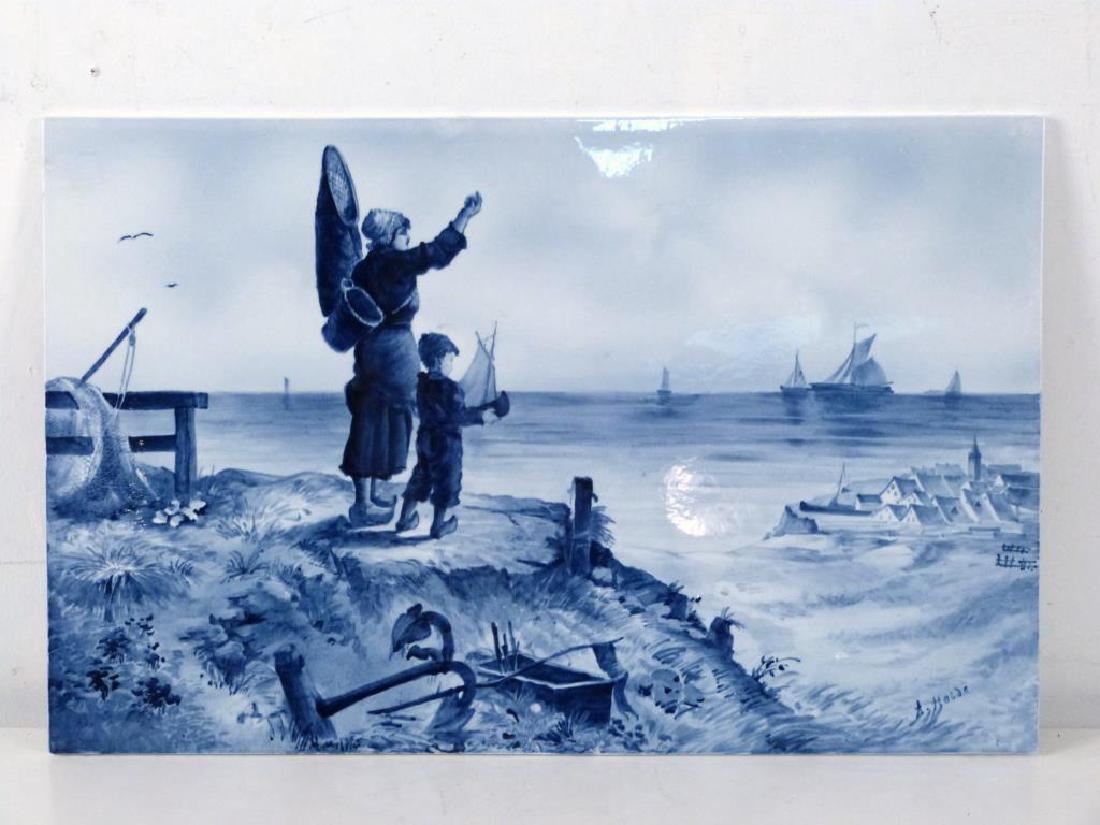 German Delft Tile: Porcelain, decorated with under glaze blue depicting mother and child at shore. 14 1/2" H X 22" W. 1/4". Crazing, hairline extending from upper left edge. As is.