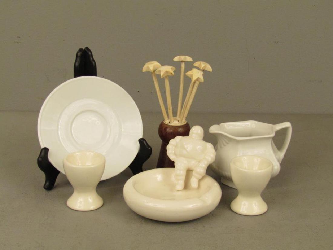 Assorted Table Top Articles: Limoges dish, Ironstone gravy boat, ceramic ashtray (similar to Michelin Man), egg cups, and bone toothpicks,
