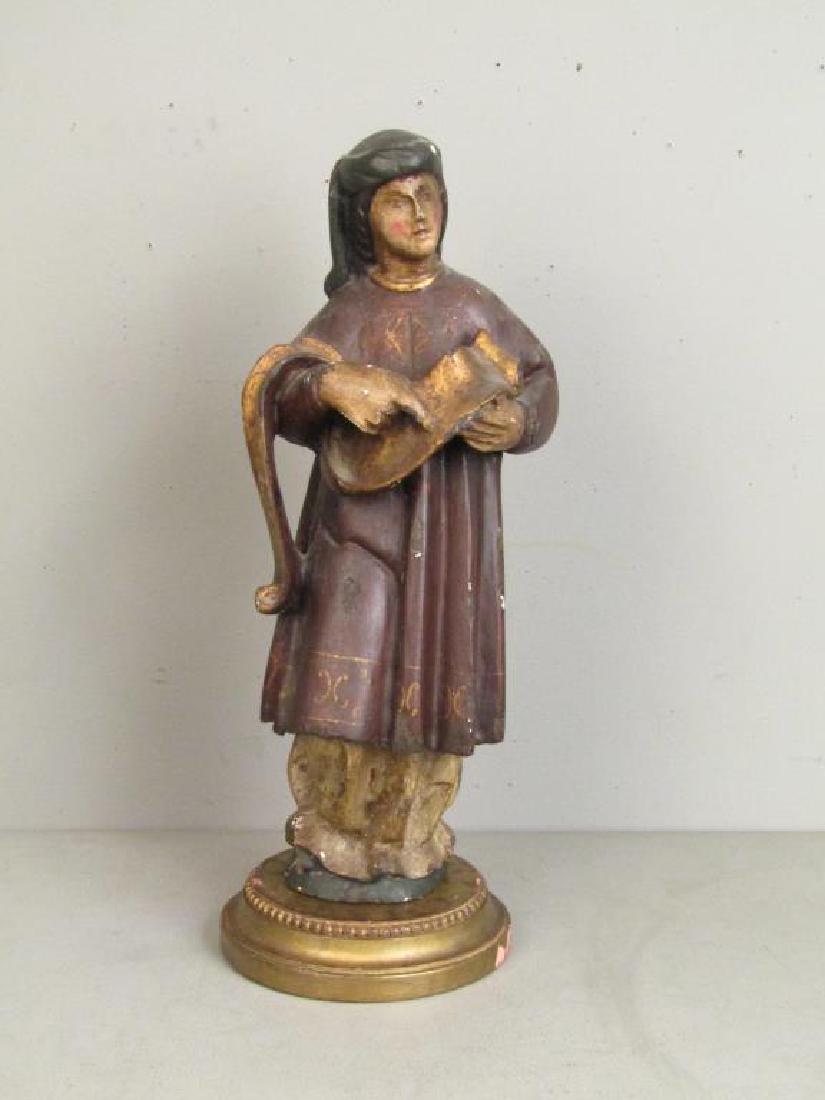 Antique Spanish Painted Wood Figure: Woman holding gilt scroll. On carved studded gilt base. Some losses, chips. 21"H on 8"Dia. X 2"H base.