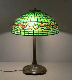 Tiffany Studios Table Lamp: 16"Dia. shade of leaded glass having a few cracks. Patinated bronze base. Shade and base signed. Small space between cap and top of shade. 21.5"H