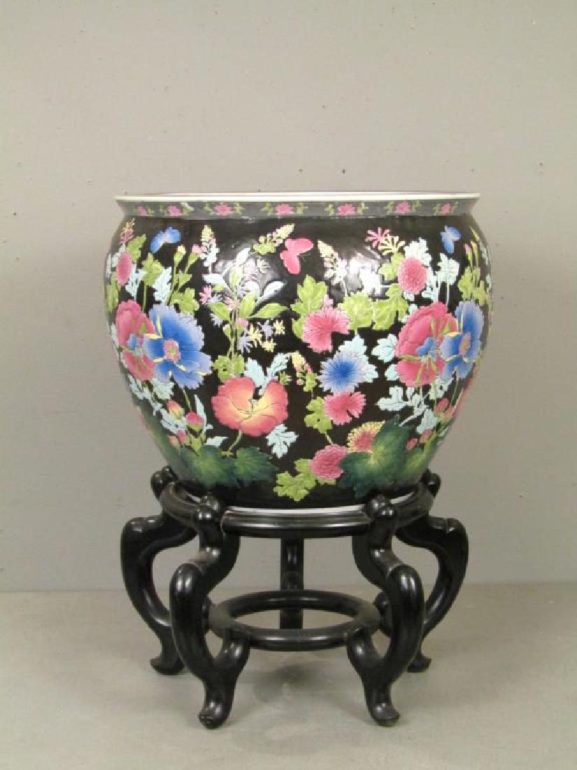 Chinese Porcelain Fish Bowl: Interior with orange and black fish. Exterior with enameled flower and butterfly design. 18"Dia. X 14"H