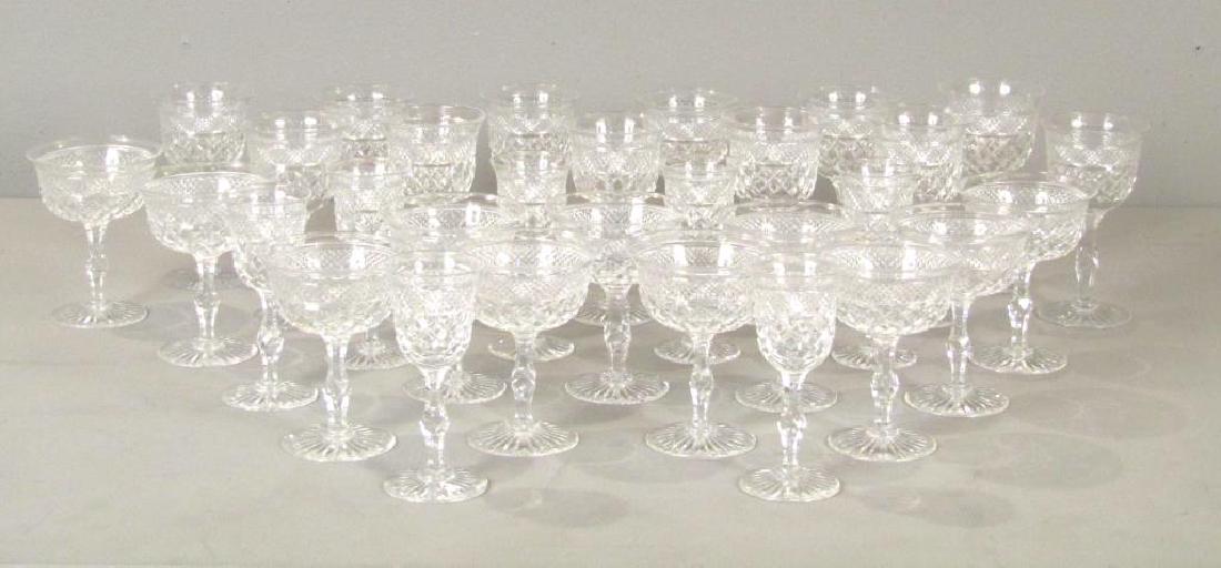 30 Piece Webb Cut Crystal Stemware Set: 12 wine glasses, 7 sherry, and 11 coupes. Marked on base. 5.5"H. Thomas Webb, England in the Russell Pattern.