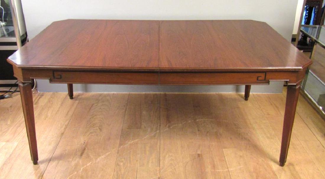Neoclassical Style Dining Table: Mahogany veneer top (splits). Greek Key design, angled squared tapered legs. Two leaves. 72"W X 44"D X 30"H. Leaves: 20". (24 Central Park South, NYC Estate)