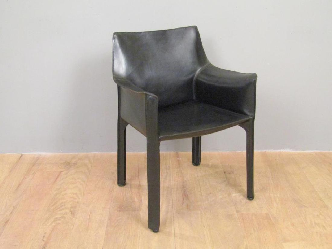 Mid Century Cassina P-1 Arm Chair: Stitched black vinyl with radius legs. Stamps under seat. Legs with zipper components. 23"D X 19"W X 31.5"H
