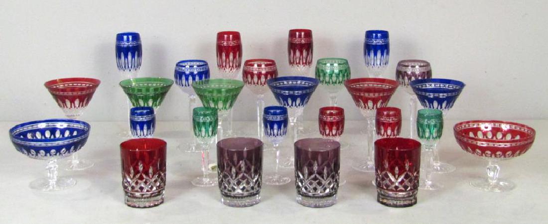 27 Piece Waterford Color Glass Stemware: Blue, red, green, and purple glasses with incised oblong forms. 4 flute (10"H), 4 wine, 6 martini, 2 coupe, 6 sherry, 4 tumblers.
