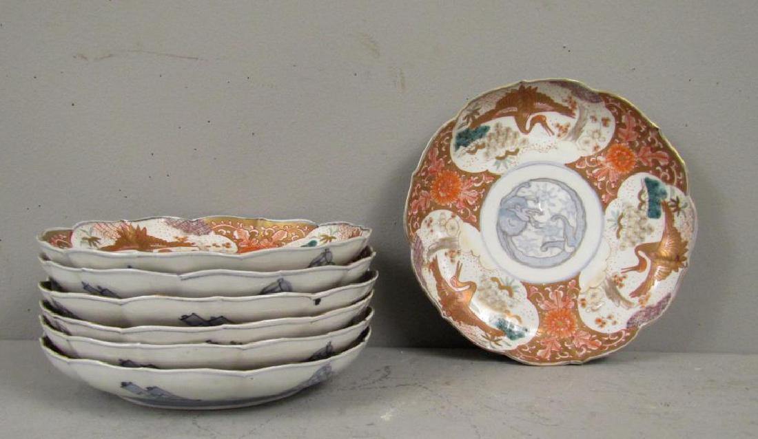 Set of 7 Antique Imari Plates: Crane designs with gilt and green scalloped rim. Signed on bottom. 8.5"Dia.
