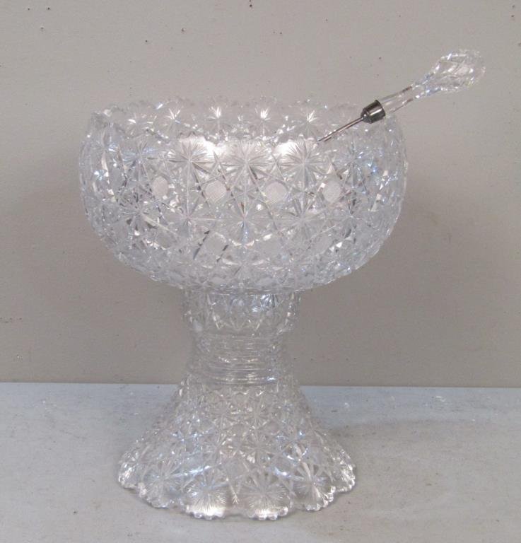 Cut Glass Punch Bowl and Ladle: In 2 parts. 14"dia X 16"h. Ladle 17" long. Chips. (To Hutter Auctions from a Hauppauge Long Island Estate)