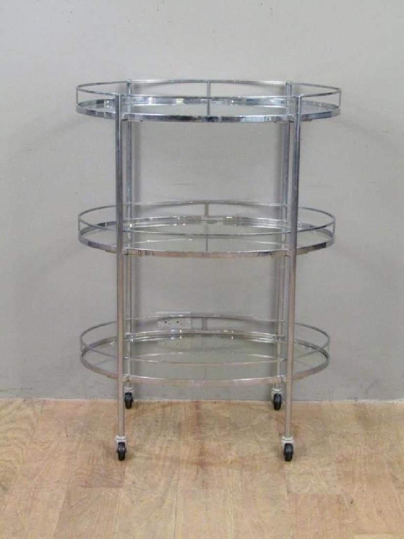 Modern Chrome 3 Tier Bar Cart: 3 oval glass shelves in chrome frame. On casters. 30.5"W X 18.5"D X 42"H (From a Jericho NY Estate)