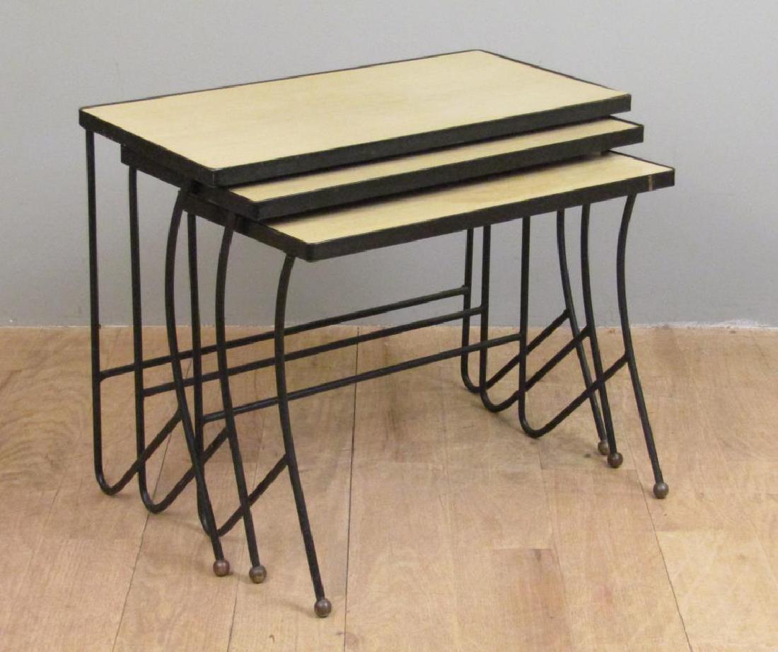 Nest of 3 Mid Century Tables: Steel frames with ball feet. Smallest with large water stain. 30.5"W X 15"D X 24"H
