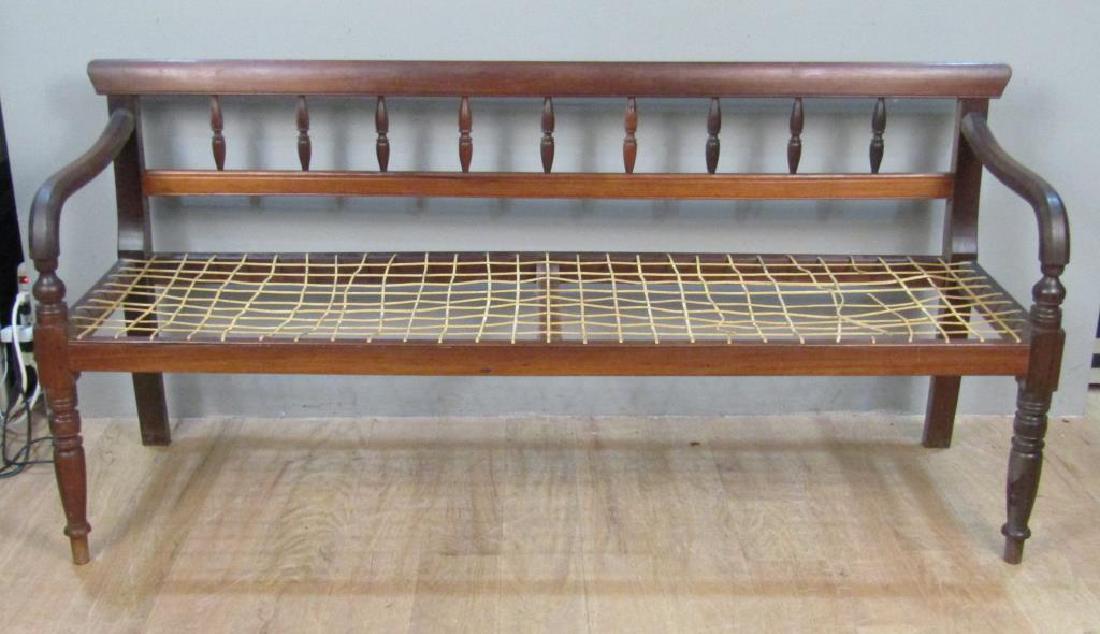 Antique South African Cape Dutch Rusvak: Spindle back, wood dowel and turned legs. 74"W X 23"D X 34"H. Likely Stinkwood, circa 2nd half 19th Century.