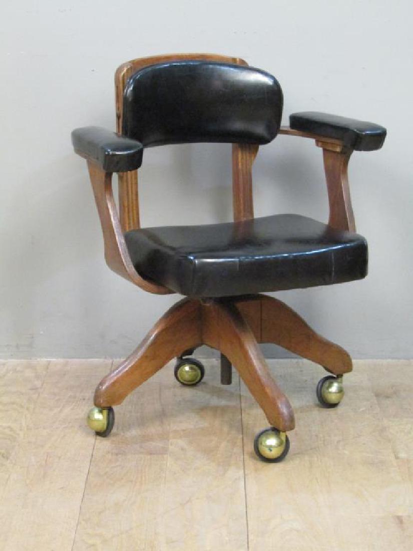 Domore Chair Company Swivel Arm Chair: Vinyl upholstered back, seat, and arm rests. On casters. Label on bottom. 25"W X 25"D X 30"H