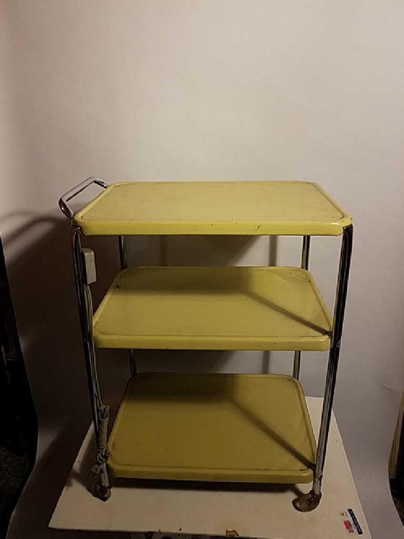 2 yellow metal serving carts: Kitch, enameled