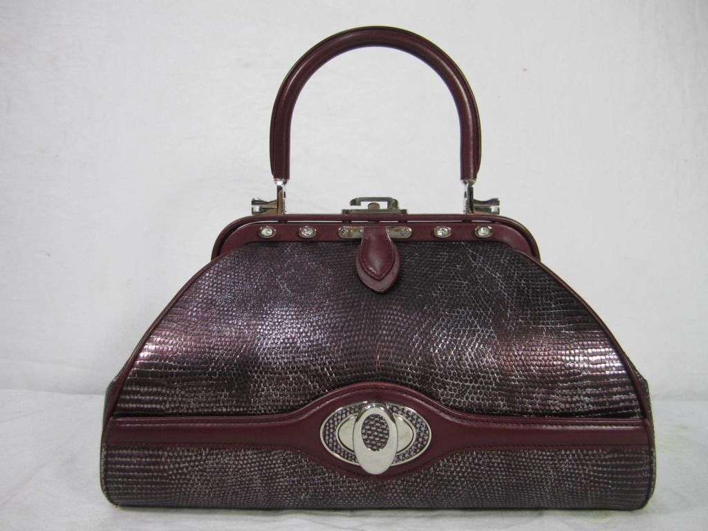 Judith Leiber "007" Purple Ladies Purse: Iridescent purple faux alligator leather. Bottom secret compartment. Faux diamond inset feet.