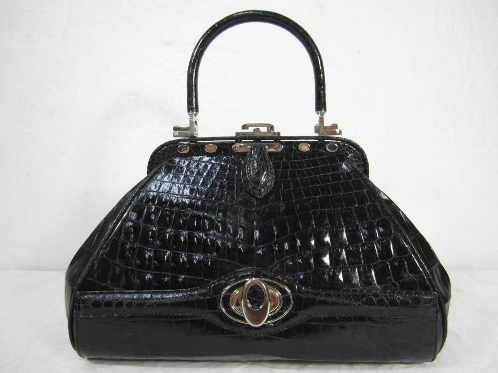 Judith Leiber "007" Black Ladies Purse: Black faux alligator leather. Bottom secret compartment. Faux diamond inset feet.