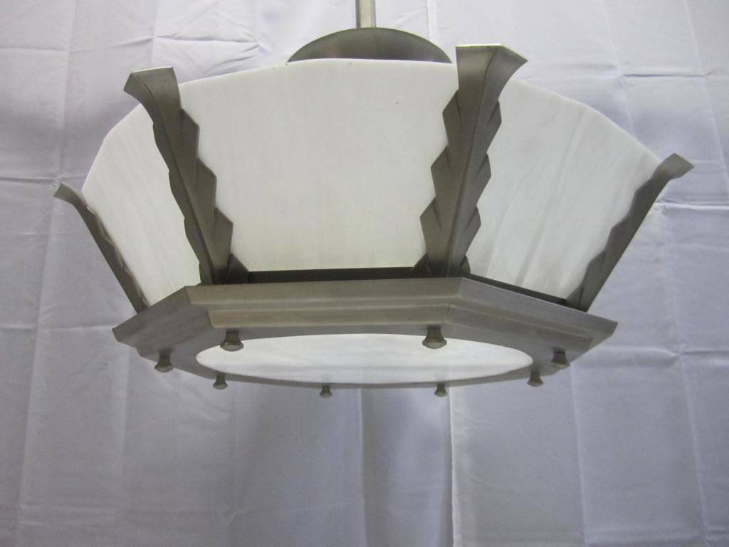 One Art Deco Aluminum Framed Chandelier Fixture: Art Deco Architectural style either from or modeled after the Fixtures in the Horn and Hardart Automats NYC. White slag glass inserts and base. 23 diameter and 13 tall body X 38 to ceiling cap.