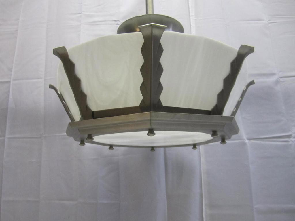 One Art Deco Aluminum Framed Chandelier Fixture: Art Deco Architectural style either from or modeled after the Fixtures in the Horn and Hardart Automats NYC. White slag glass inserts and base. 23 diameter and 13 tall body X 25 to ceiling cap.