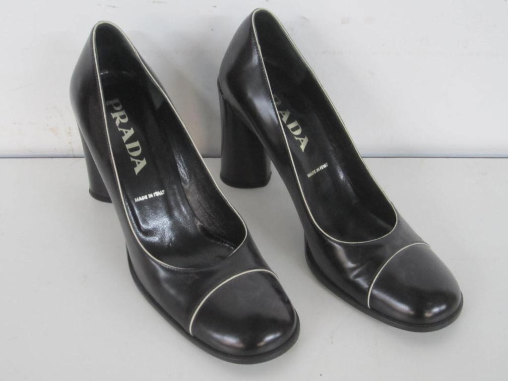 Pair Prada Black Leather Shoes: Pair Prada Black Leather Shoes White piping trim. Size 36 1/2. Very good condition, wear on bottom.