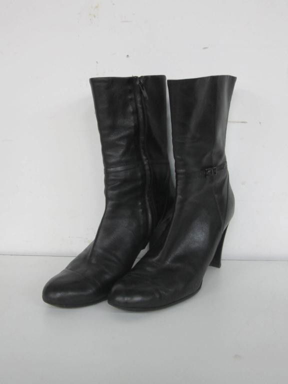 Pair Giorgio Armani Black Leather Boots: Pair Giorgio Armani Black Leather Boots High heels with zipper sides. Size 38.