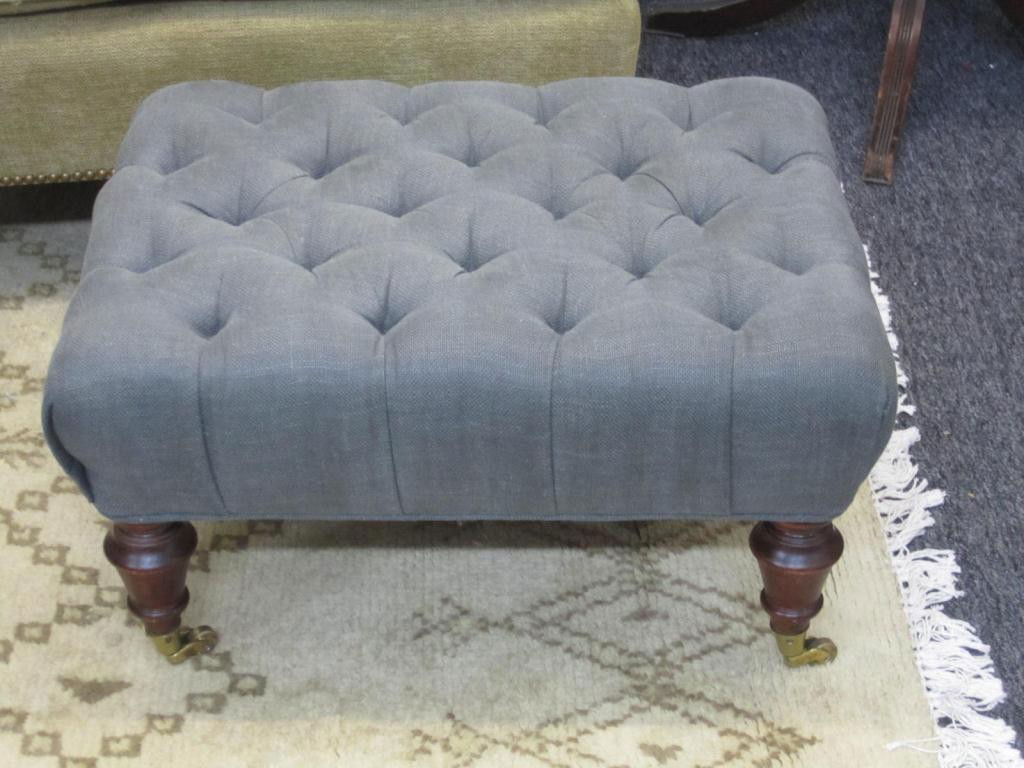 George Smith Style Upholstered Ottoman: George Smith Style Upholstered Ottoman button tufted with turned legs on castors. 24 X 18 X 13 tall.